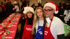 Harry Hamlin and Lisa Rinna with their daughter Delilah serve up Christmas dinner to the homeless at the Los Angeles Mission in Los Angeles, Ca