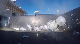 Man blows up Christmas ornaments with 'pocket laser cannon'