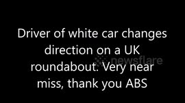 Bad white car driver changes direction on roundabout