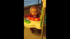 Baby boy fights sleep to keep jumping longer.