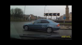 Cyclist almost cycles straight into oncoming traffic.