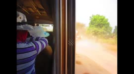 Laos - Rough road on bus to buddha park