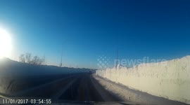 Particularly high snowbanks border Canadian road