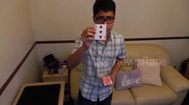 Magician Magic Mike does biting trick with playing card