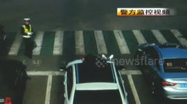 Man jumps off tricycle and dives onto the bonnet of a car