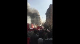 The moment a high-rise building collapsed in Tehran, trapping firefighters inside