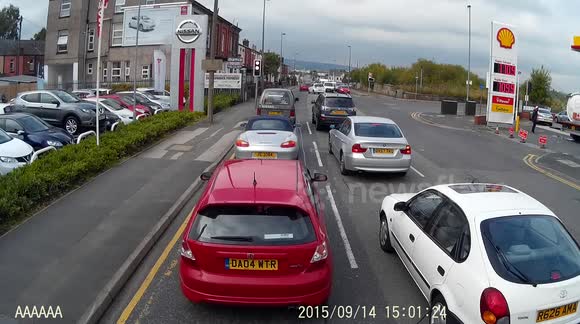 insecure load  on a white van, ladders fall from the vans roof