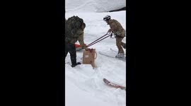 The military helping inhabitants reach the helicopter