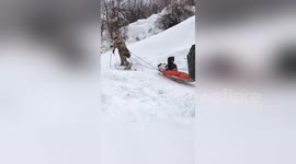 Italian soldiers evacuate stranded locals from villages near to hotel buried by avalanche