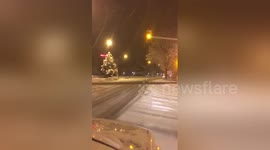Car overturns while sliding on snowy road