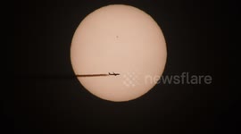 Cool footage of a plane crossing the Sun