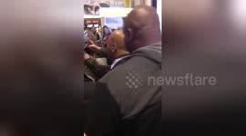Newsflare Edit - John Lewis arriving at airport to chants and cheers