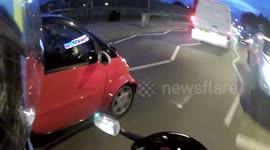 Smart car driver thinks he is riding a motorbike