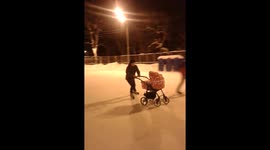 Father skating with baby carriage