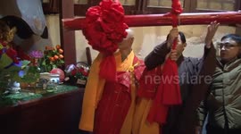 Thousands ring bell at Chinese Buddhist Temple to usher in new year