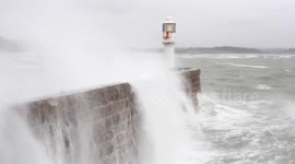 Huge wave crashes onto pier during storm Doris in Cornwall