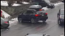 Car spins down icy slope in Massachusetts