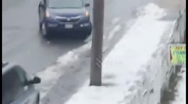 Car spins down icy slope in Massachusetts